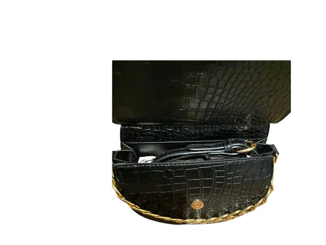 Black crocodile pattern crossbody bag with gold chain strap, open to show interior compartments